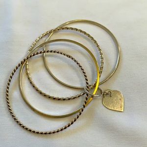 Silver bangles with heart charm purchased from Fortunoffs.